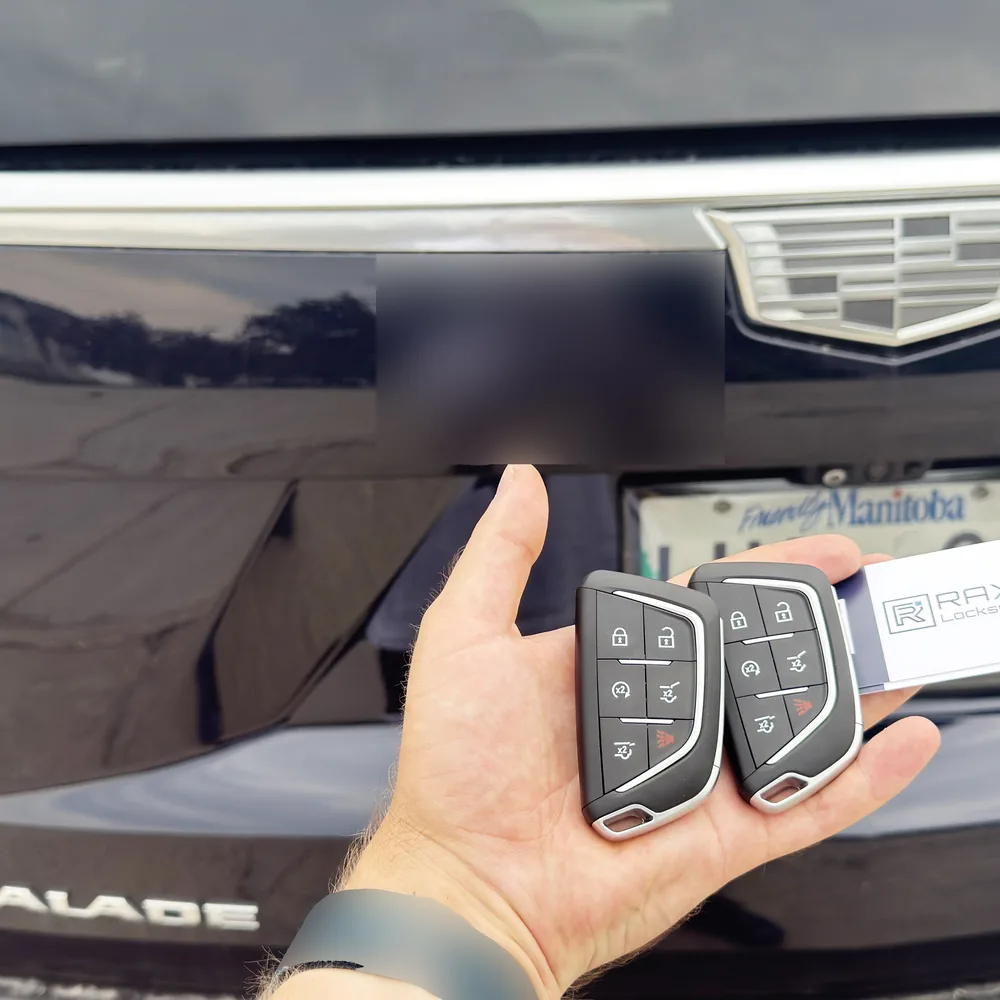 Two Cadillac Escalade smart key fobs cut and programmed on-site in Winnipeg