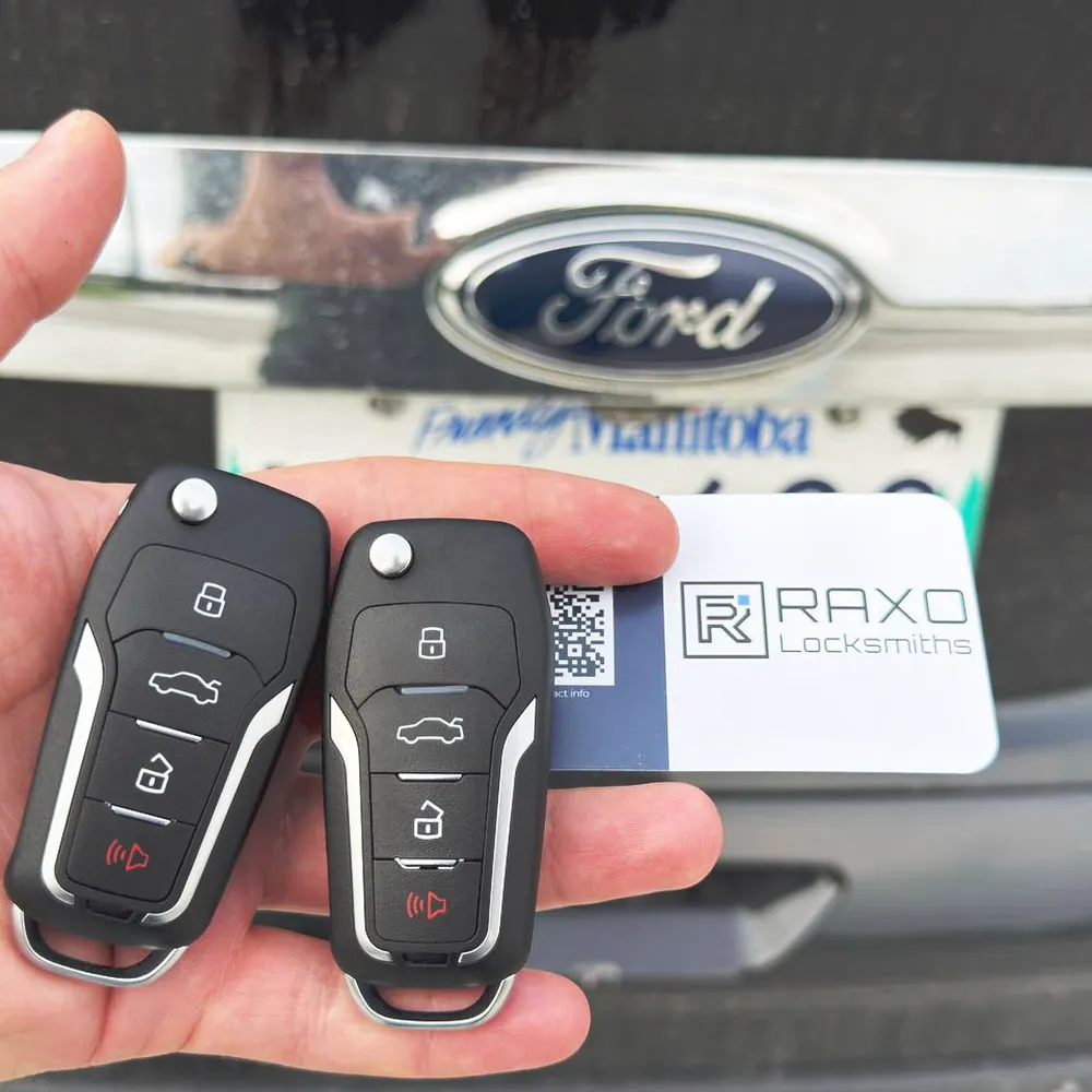 Two new flip keys cut and programmed for a Ford after an all-keys-lost job in Winnipeg