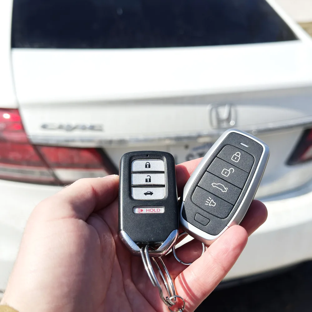 A new smart key beside the original for a Honda Civic, programmed on-site in Winnipeg