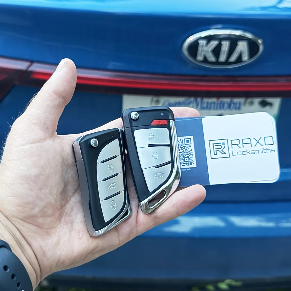 Two new flip keys cut and programmed for a Kia Forte after an all-keys-lost job in Winnipeg