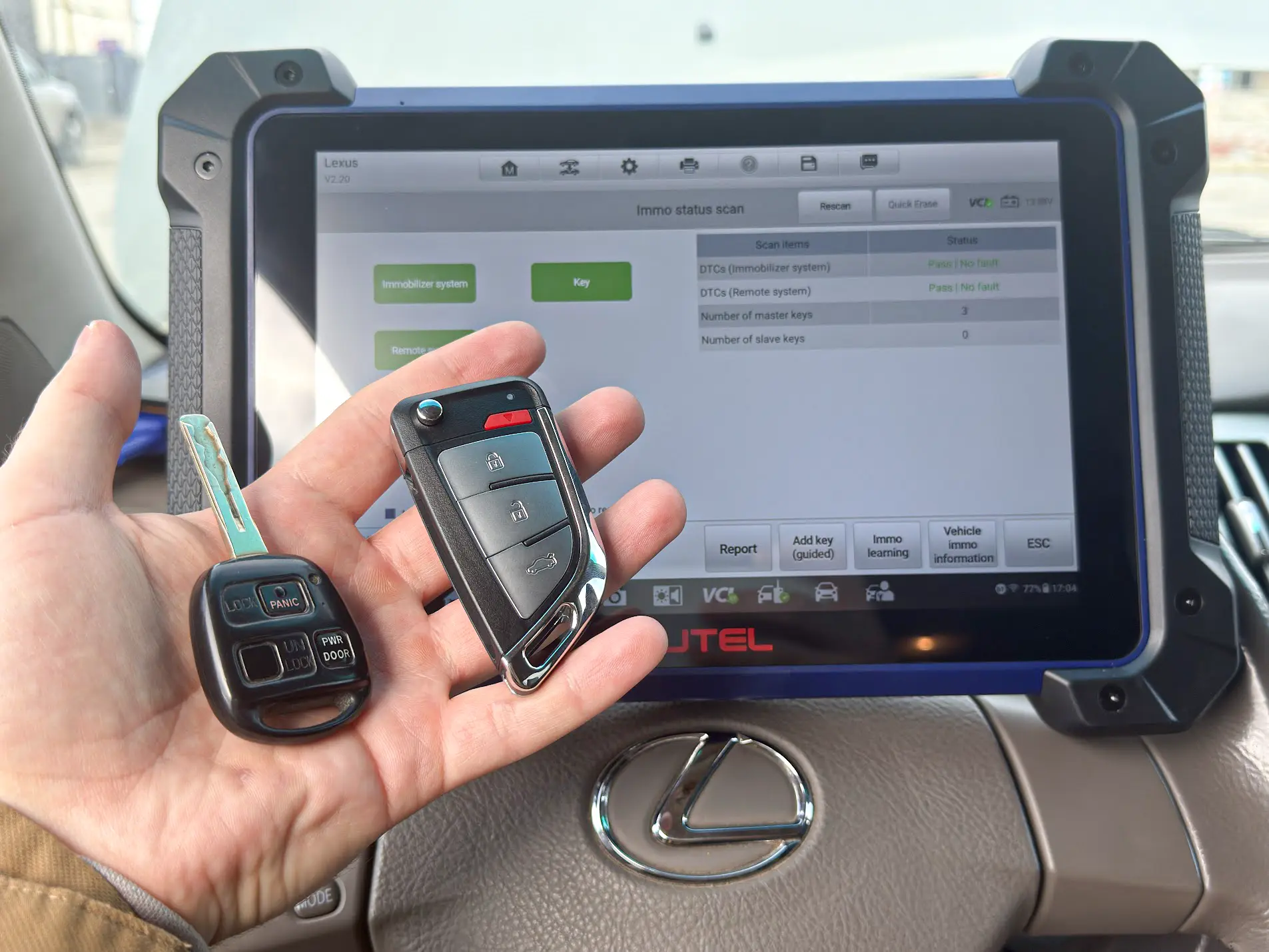 Toyota 8A Smart Key fob side-by-side with older H-chip transponder for visual contrast